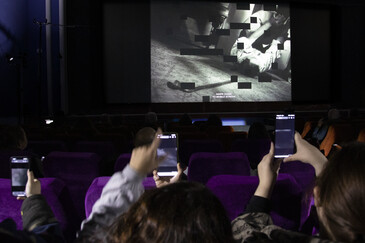 View of the dispositif Swipe to Swipe to ... in a movie theater