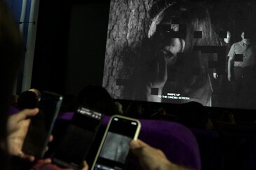View of the dispositif Swipe to Swipe to ... in a movie theater